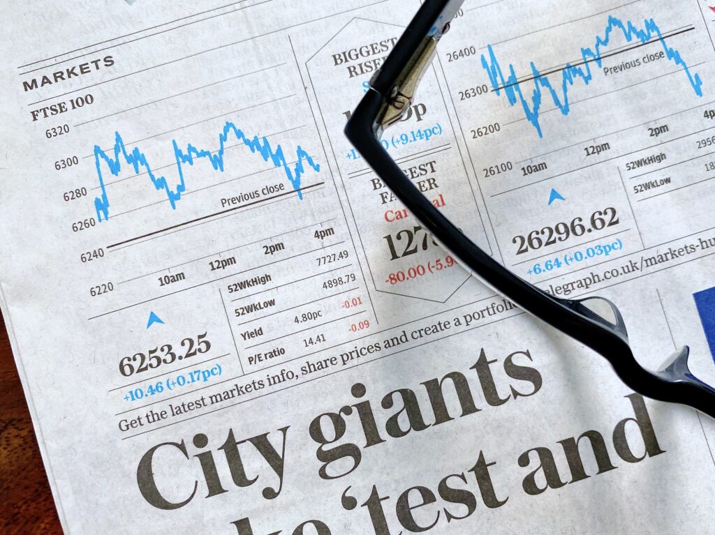 business-and-finance-concept-closeup-view-of-a-financial-newspaper-with-a-line-graph-showing-the-ftse
