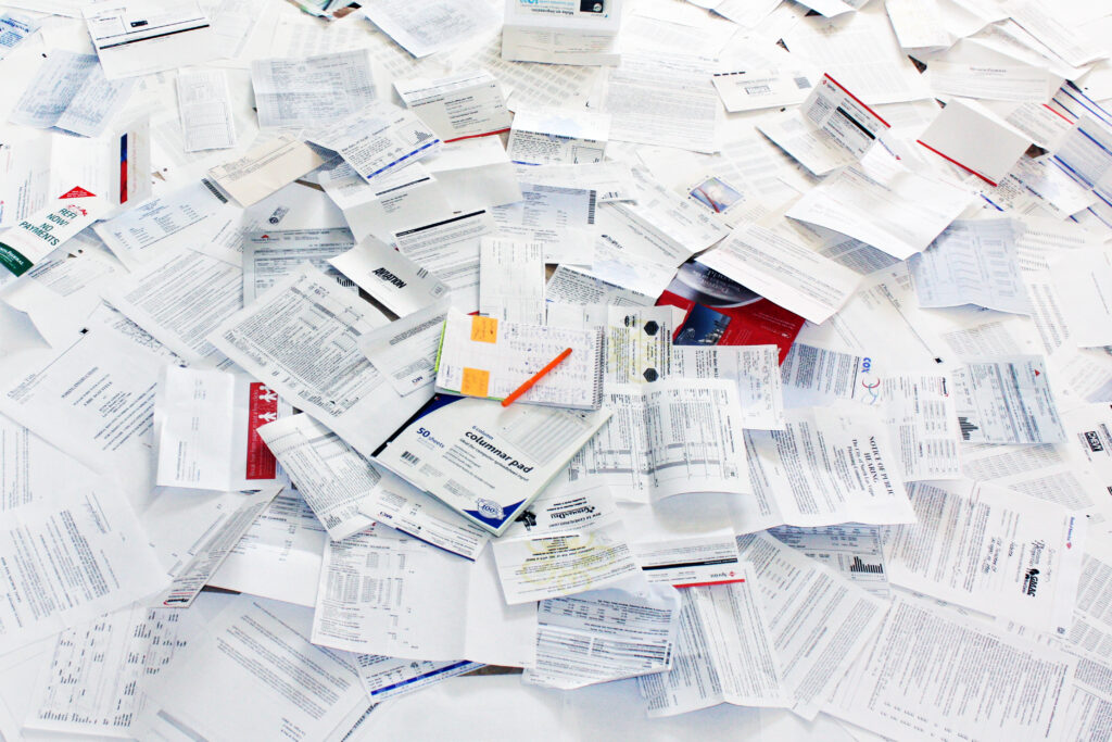 pile-of-bills-receipts-and-paperwork